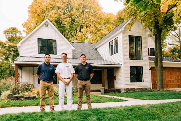 A Five Star Painting professional team outside of a customer's home
